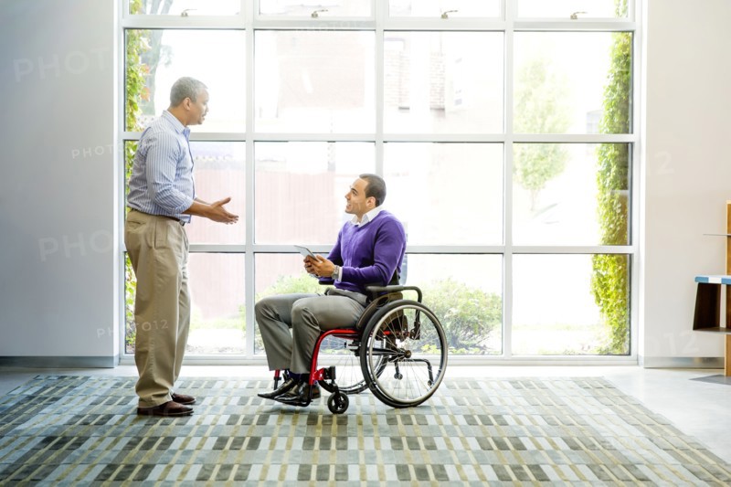 Businessmen talking in office