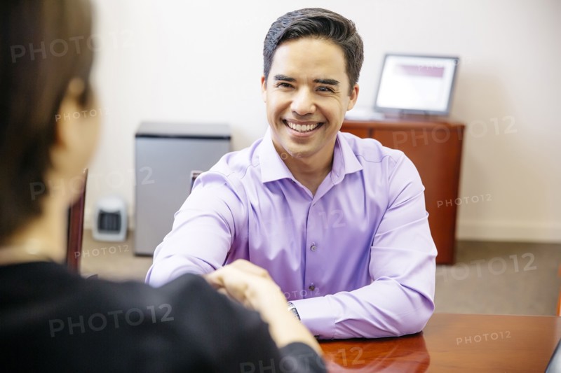 Business people shaking hands in office
