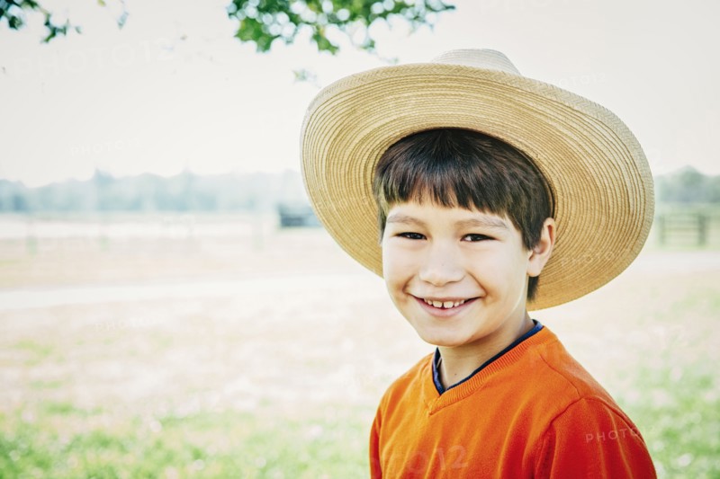 Caucasian boy smiling on farm
