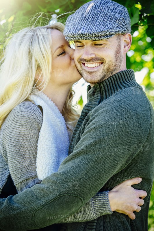 Caucasian couple kissing outdoors