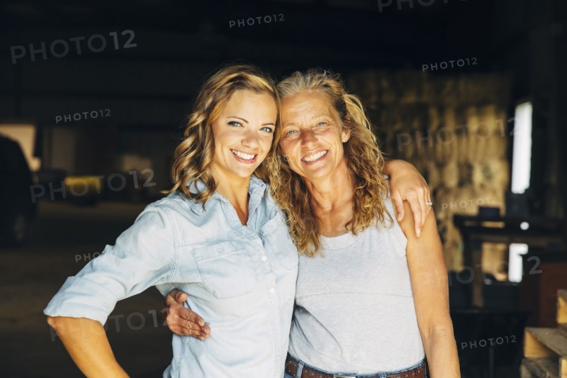 Caucasian mother and daughter hugging