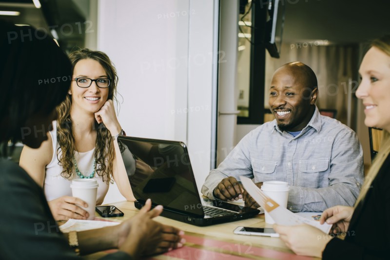 Business people working together in cafe