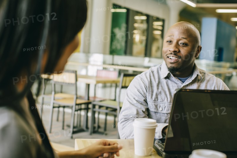 Business people working together in cafe