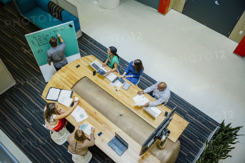 High angle view of business people working in office meeting