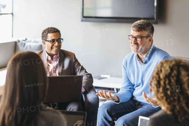 Business people talking in office meeting