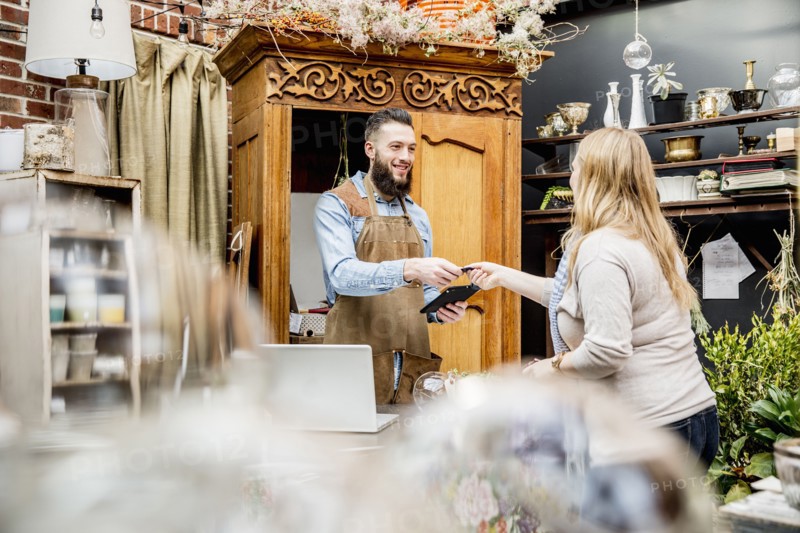 Employee helping customer shopping in store