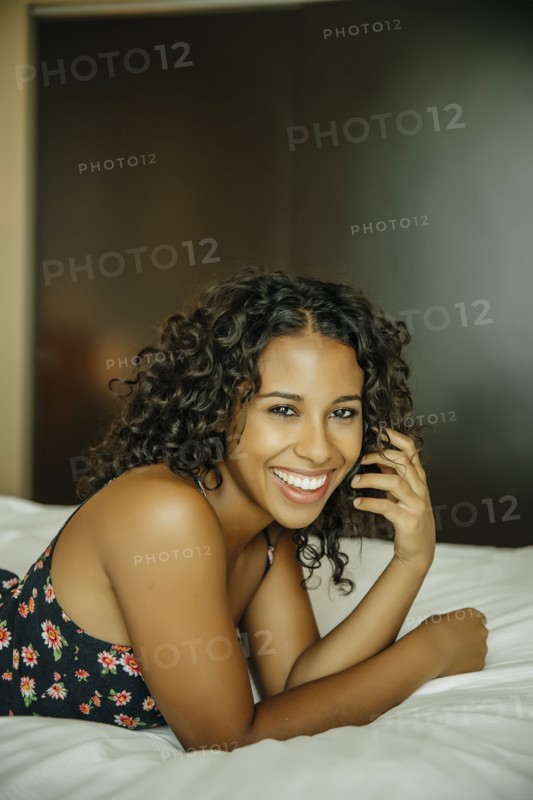 Close up of woman laying on hotel bed