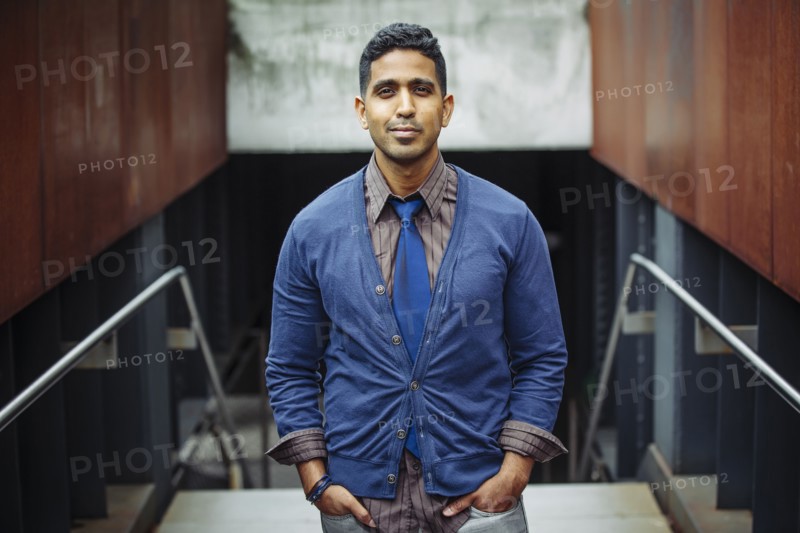 Indian businessman standing on office steps