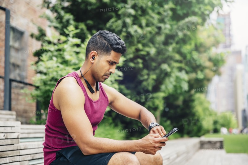 Indian athlete timing himself in city