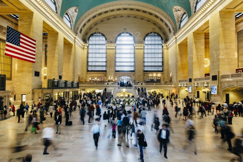Blurred view of people in train station