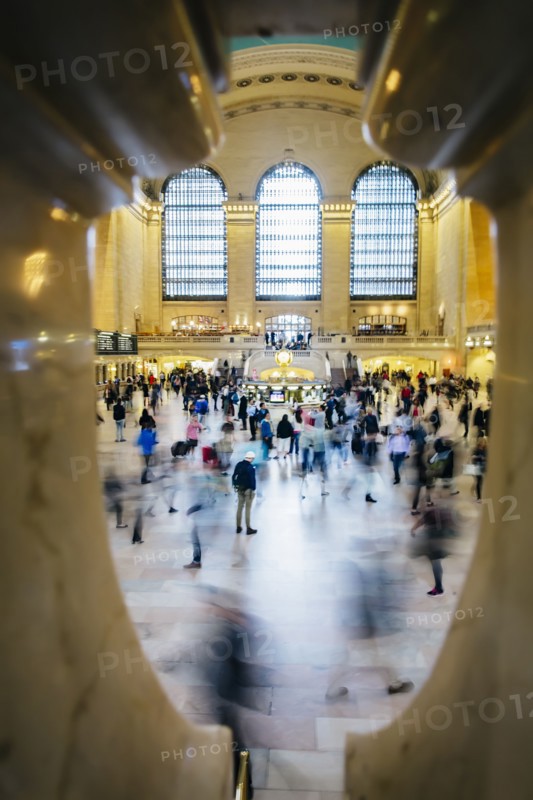 Blurred view of people in train station