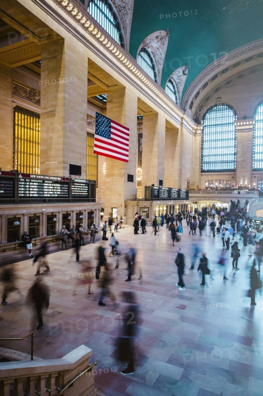Blurred view of people in train station
