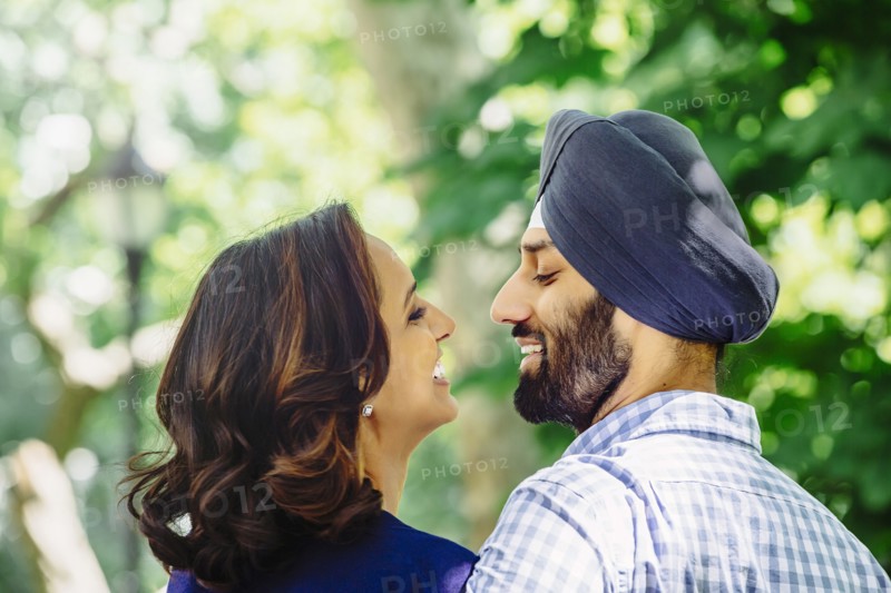 Close up of smiling Indian couple hugging