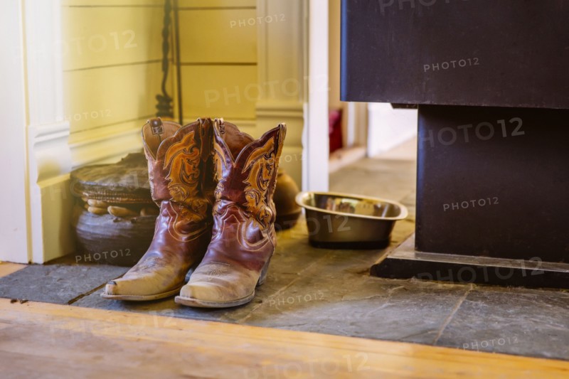 Dirty boots on stone tile