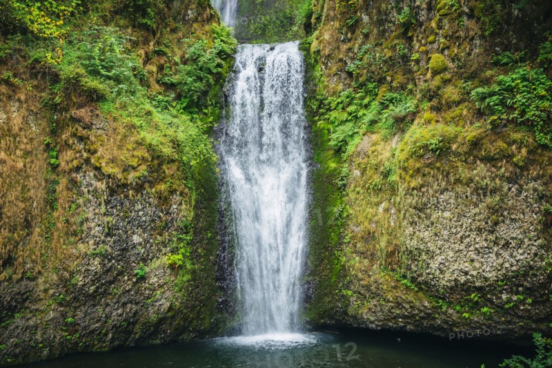 Multnomah Falls over rocky hillside