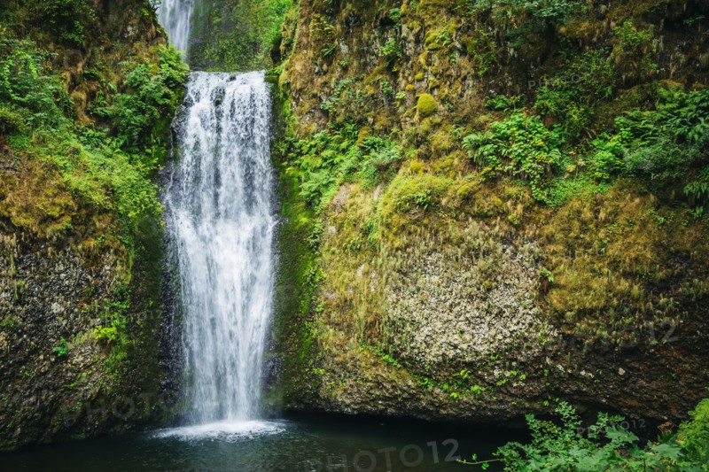 Multnomah Falls over rocky hillside