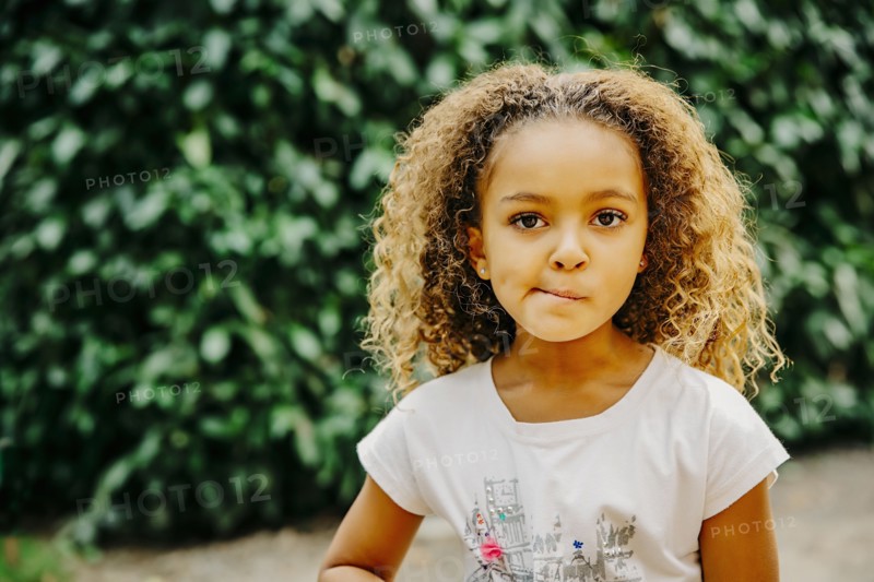 Mixed race girl standing outdoors