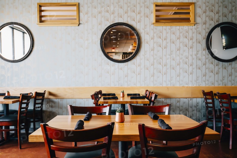 Empty chairs and tables in cafe