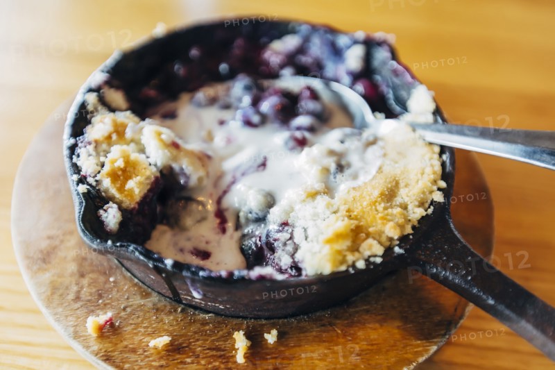 Skillet dessert with melted ice cream