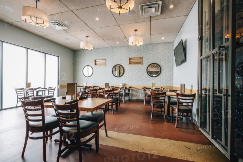 Empty tables and chairs in restaurant