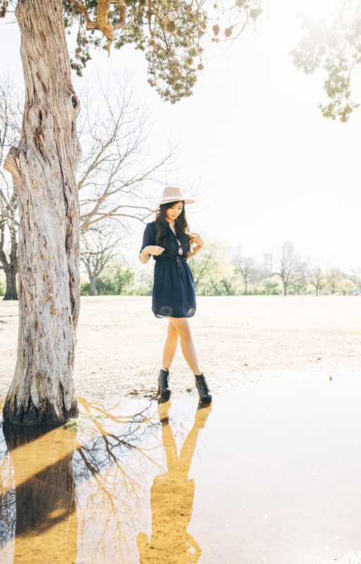 Chinese woman walking near pond