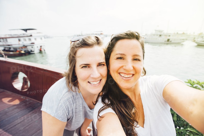 Women taking selfie on Ha Long Bay waterfront