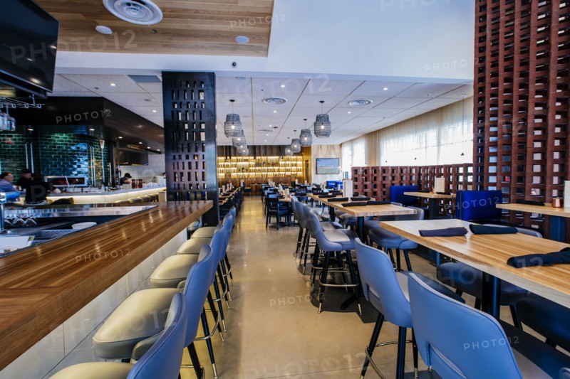 Tables and chairs in modern bar and restaurant