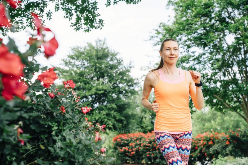 Smiling Caucasian woman running