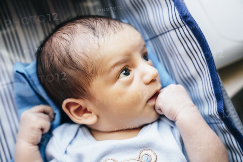 Curious baby boy looking up