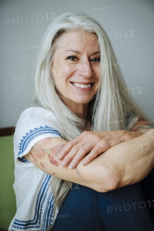 Caucasian woman sitting in armchair