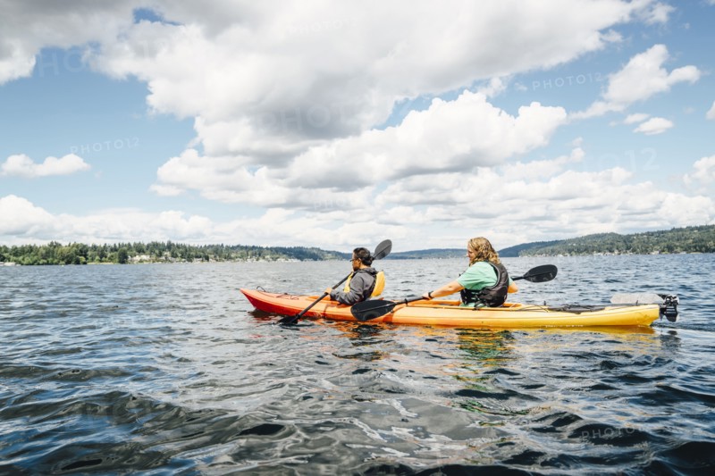 Man and woman paddling kayak