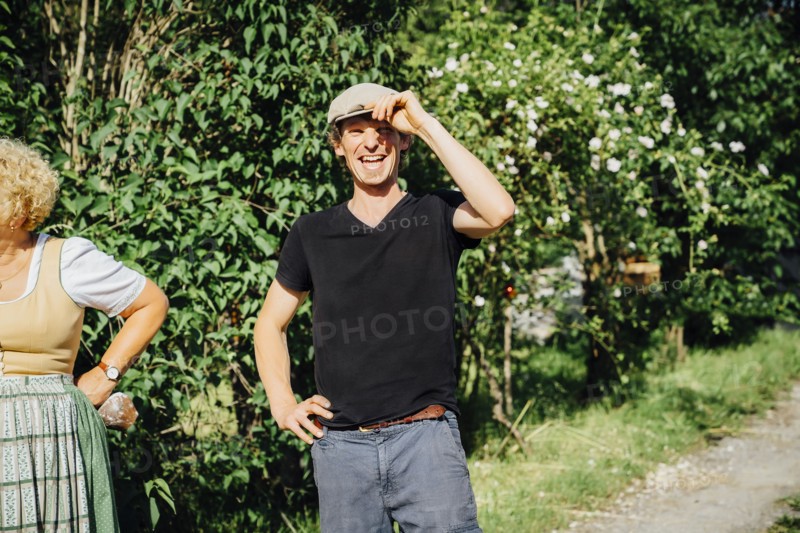 Smiling Caucasian man tipping cap
