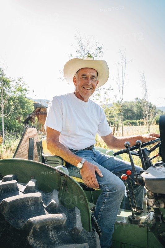 Caucasian farmer sitting on tractor