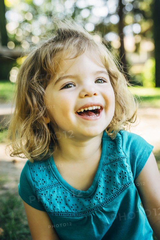 Portrait of laughing Caucasian preschool girl