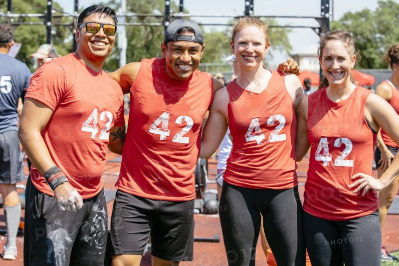 Portrait of friends wearing shirts with number 42