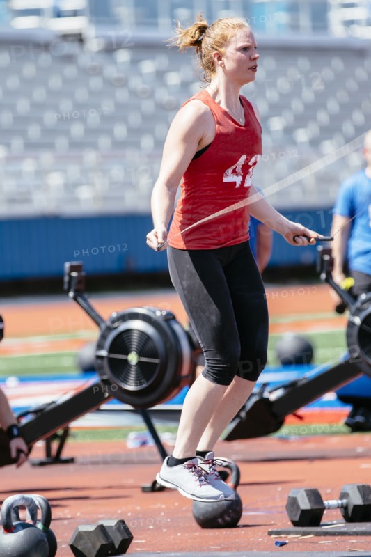 Caucasian woman jumping rope outdoors