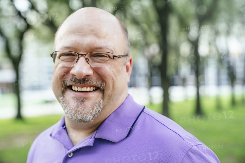 Portrait of laughing Caucasian man in park