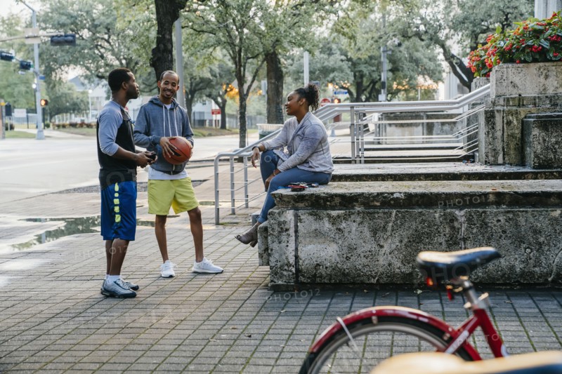 Black friends with basketball hanging out