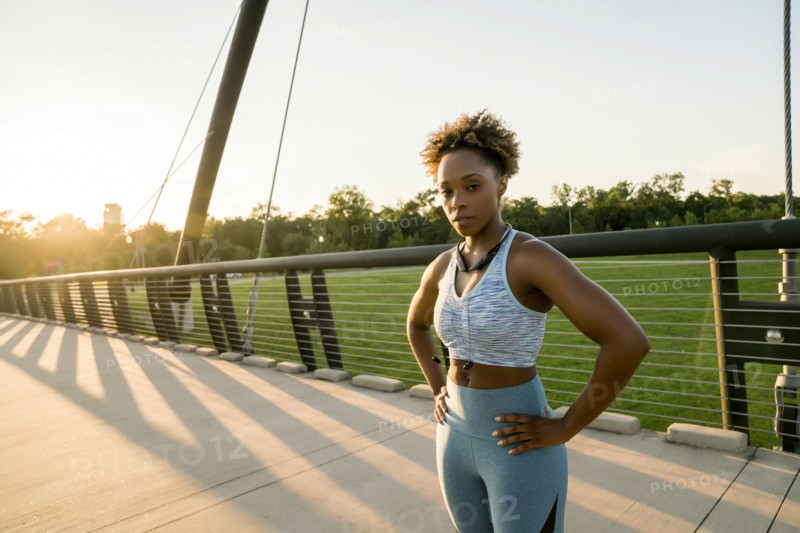 Mixed race woman resting on bridge