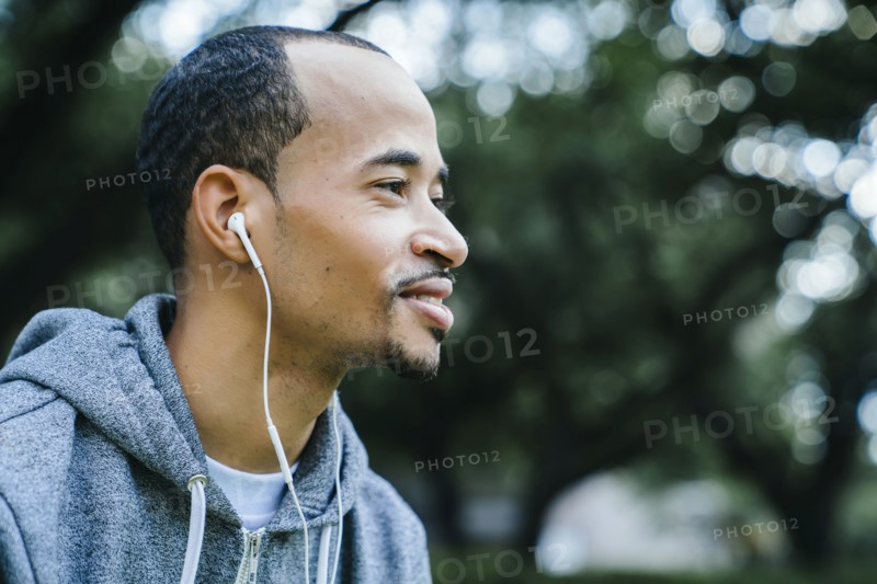 Black man listening to earbuds