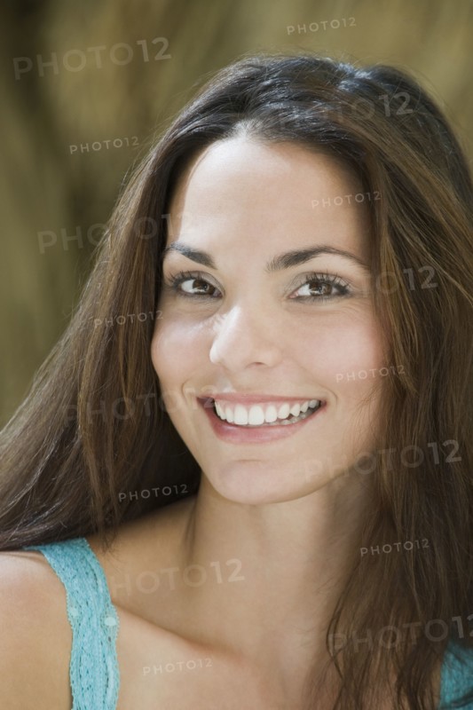 Close up of smiling Hispanic woman