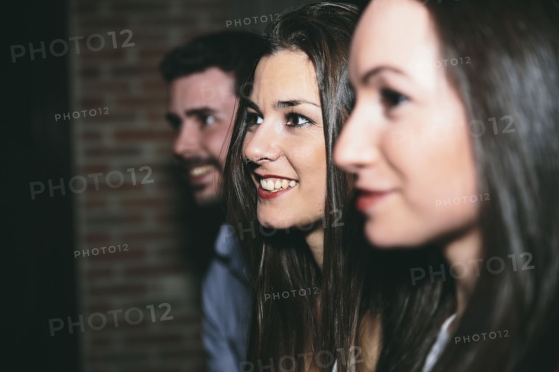 Friends smiling in nightclub