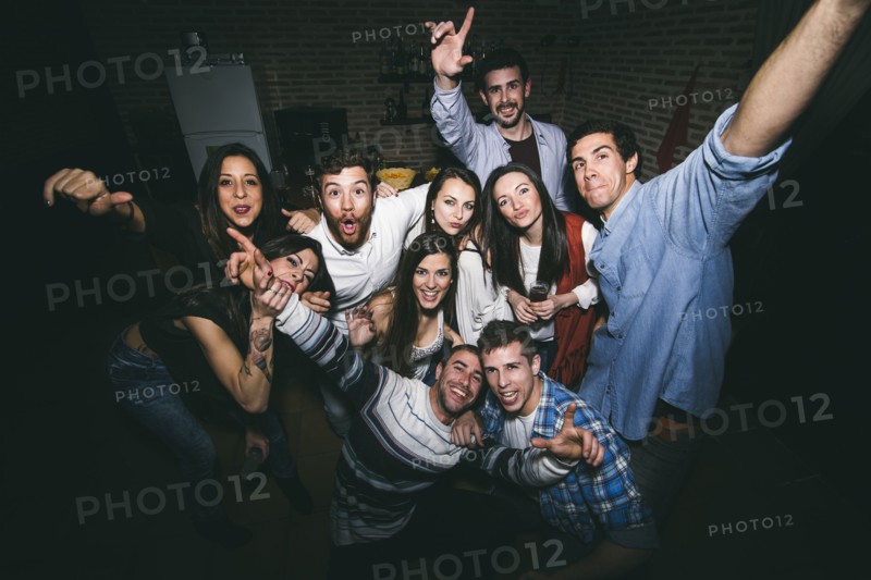 Smiling friends posing in nightclub