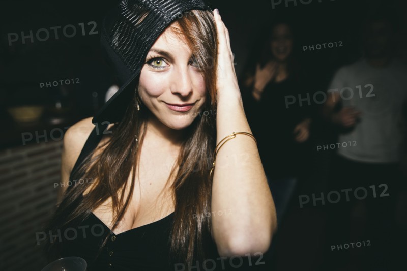 Smiling woman dancing in nightclub