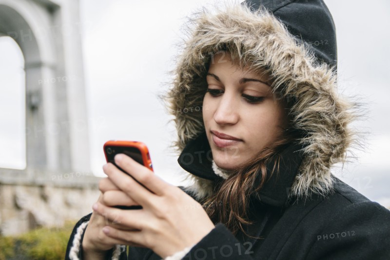 Caucasian woman using cell phone