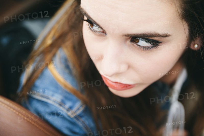 High angle view of Caucasian woman looking over shoulder