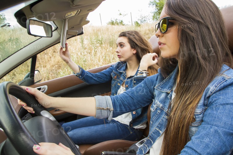 Women driving in convertible