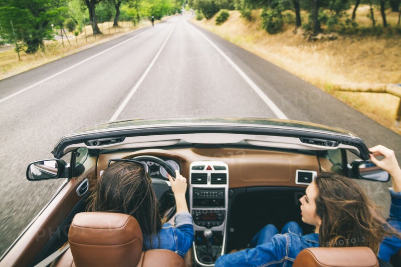Women driving in convertible