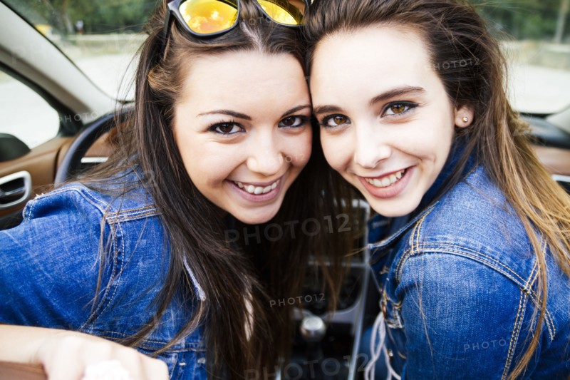 Women smiling in convertible