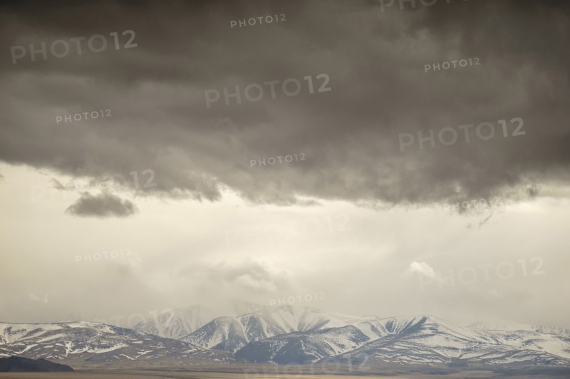 Storm clouds over mountain landscape
